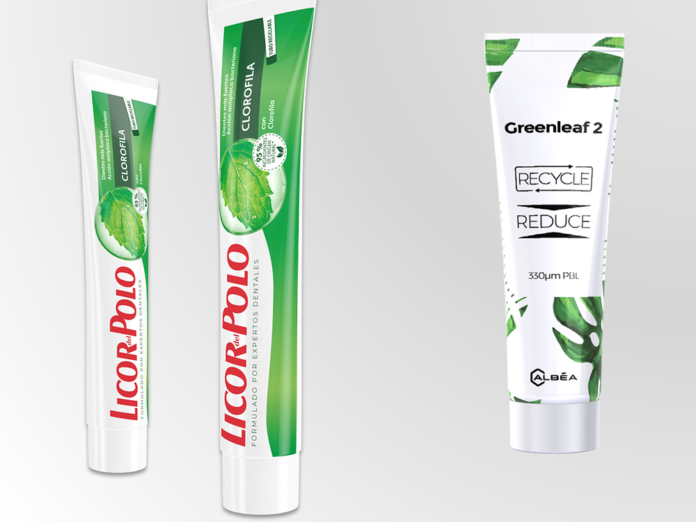 Recyclable toothpaste tubes lined up next to each other.
